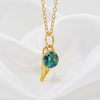 14kt gold-filled cremation pendant with ash and crushed opal inlay. 6 mm pendant.  included gold angel wing with opal inlay and ash.