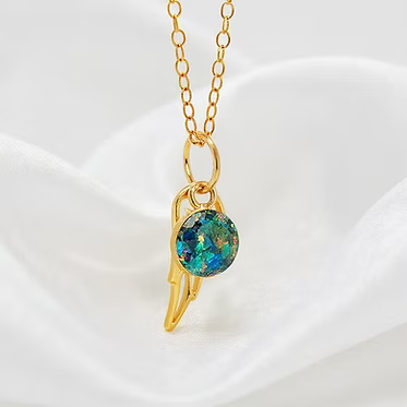 14kt gold-filled cremation pendant with ash and crushed opal inlay. 6 mm pendant.  included gold angel wing with opal inlay and ash.