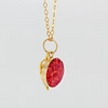 14kt gold-filled cremation pendant with ash and crushed opal inlay. 12 mm pendant. Includes a gold angel wing with opal inlay and ash.