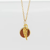 14kt gold-filled cremation pendant with ash and crushed opal inlay. 12 mm pendant. Includes a gold angel wing with opal inlay and ash.