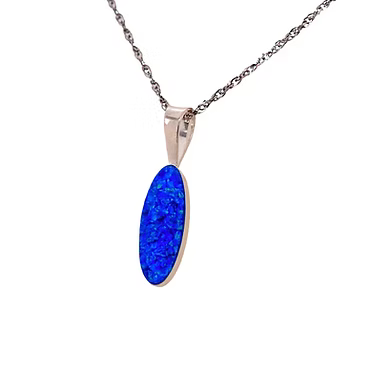 An oval blue opal pendant necklace in a rose gold setting on a delicate silver-toned chain, shown against a plain white background.