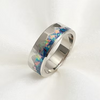 A polished silver band ring featuring a vibrant, multicolored inlay of opal with shades of blue, green, pink, and orange, set against a clean white background.