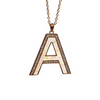A rose gold letter 'A' pendant necklace with a white opal inlay and clear crystal accents, hanging from a matching rose gold chain against a solid white background.