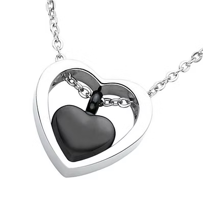 A silver heart-shaped locket necklace with a polished black heart pendant inside, shown on a white background.