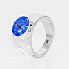 A silver ring featuring a round, vibrant blue opal gemstone with orange and green flashes, set in a polished silver band on a white background.