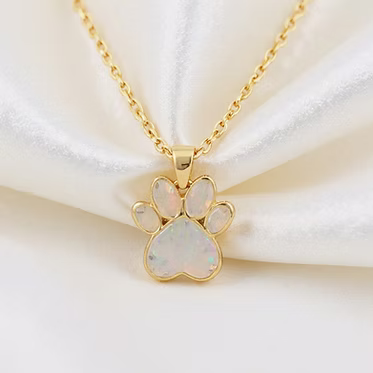 gold chain with paw print pendant and opal inlay