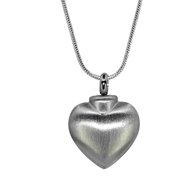 A silver heart-shaped urn pendant necklace on a delicate silver chain, shown against a plain white background.
