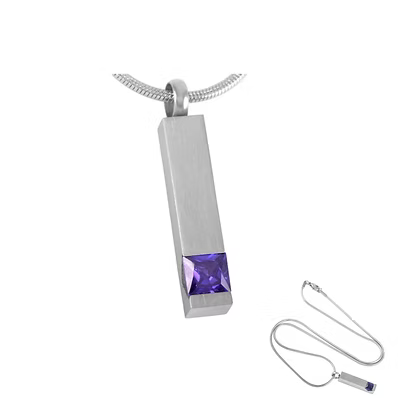 A silver-toned rectangular cremation urn pendant necklace with a faceted purple gemstone at the bottom, shown on a white background with an additional detached chain and pendant inset.