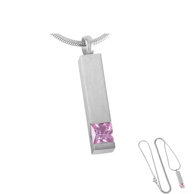 A silver-toned rectangular pendant necklace with a faceted pink gemstone at the bottom, shown on a white background with an inset of the necklace chain and clasp detail.