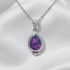 a large pear shaped pendant in .960 silver with chain and custom opal inlay