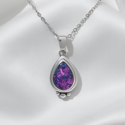 a large pear shaped pendant in .960 silver with chain and custom opal inlay