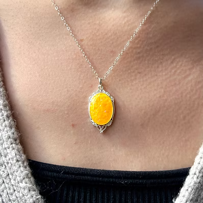 Mini victorian Pendant in .960 Argentium Silver. Featuring a custom opal and ash inlay on an 18-inch chain.
