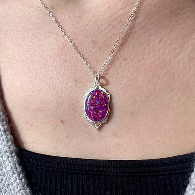 Mini Victorian pendant in .960 Argentium Silver. Featuring a custom opal and ash inlay on an 18-inch chain.
