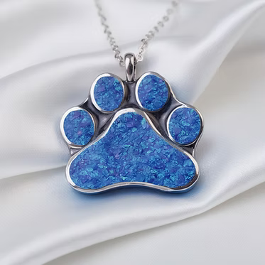 Cremation Paw Print Pendant .925 Sterling Silver with blue opal inlay on white background